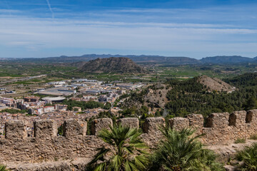 Fototapeta premium Xativa Castle or Castillo de Xativa - ancient fortification on the ancient roadway Via Augusta in Spain. Medieval ruins of the walls of Xativa castle. Xativa, Spain, Europe.