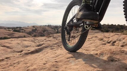 Sports, dirt and athletes cycling in desert on an adventure trail training for race or competition. Fitness, bicycle and active male cyclists riding for cardio exercise or workout on outdoor off road