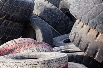 A pile of old car tires, close-up.