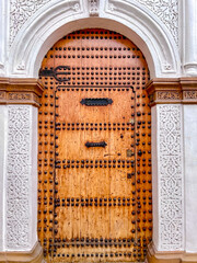 Casablanca, Morocco - December 28, 2023: Wooden doors and building entrances in the souks of Casablanca, Morocco