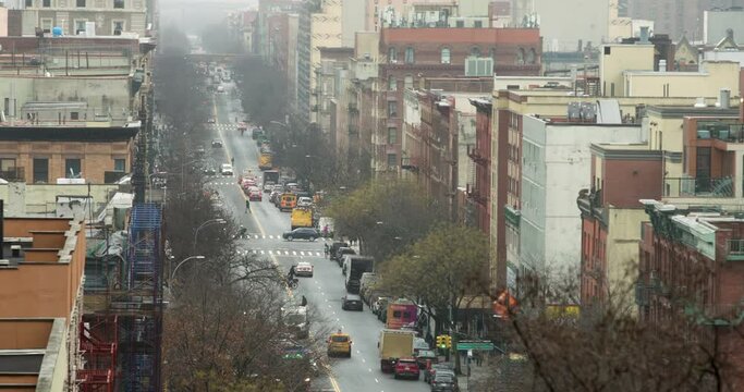 Cars, Pedestrians, Pigeons and Trains in Motion on 116th Street in Manhattan NYC
