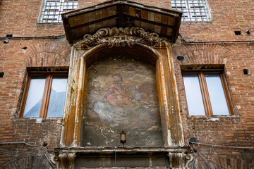 Fototapeta premium Wall art in Siena, Italy
