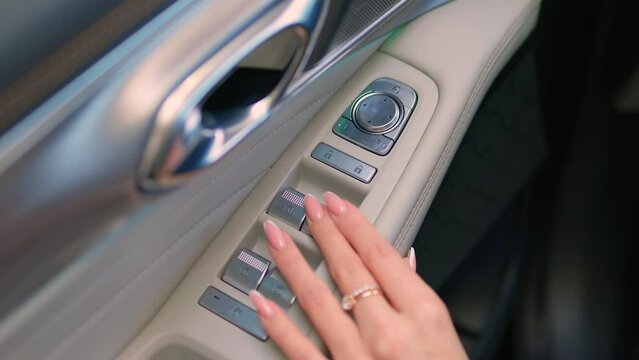 a hand in a medical glove presses the air recirculation button in the car