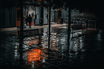 Brighton streets on a wet rainy night, reflecting surfaces with colors, East Sussex, England.