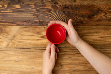 Hand Holds Cup, Empty Red Cup in Hands, Coffee Mug, Teacup, Hot Beverage Mockup