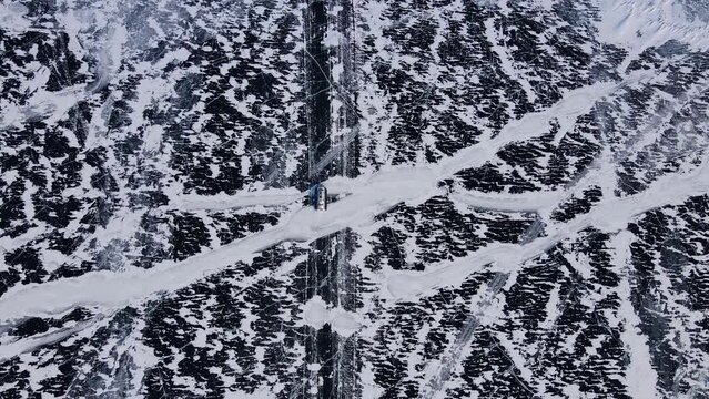 Hovercraft glides over Baikal's ice northern nature's marvel Hovercraft unusual mode transport ice. Hovercraft on lake facing snow frost extreme north Extreme travel exploring icy terrains.