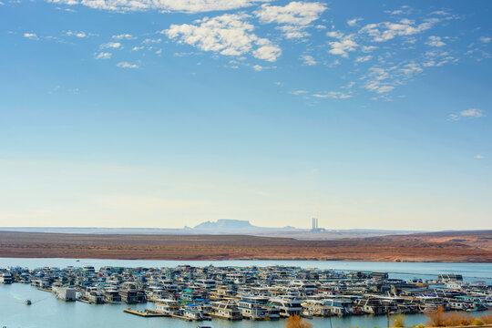 Boat Marina at Lake Powell with Coal Power Plant in the Background - 4K Ultra HD Image of Contrasting Landscapes