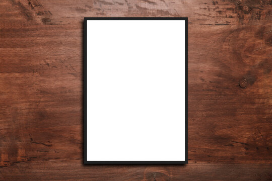 Picture frame on a white wooden wall white frame. Blank Mockup . 

