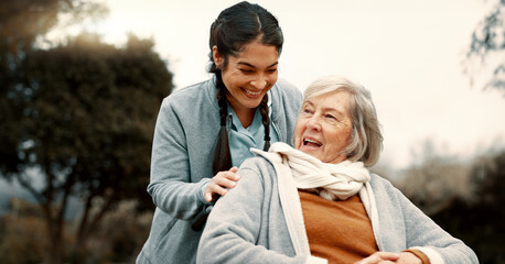 Senior woman, talking and outdoor with caregiver, nurse or healthcare service for person with a...