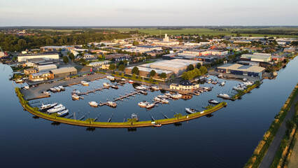 Aerial drone view of harbor, marina and industrial area in Steenwijk, The Netherlands. Company...