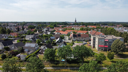 Fototapeta na wymiar Aerial drone view of homes, houses and apartments in Steenwijk, Overijssel, The Netherlands. Residential area neighborhood architecture captured from above.