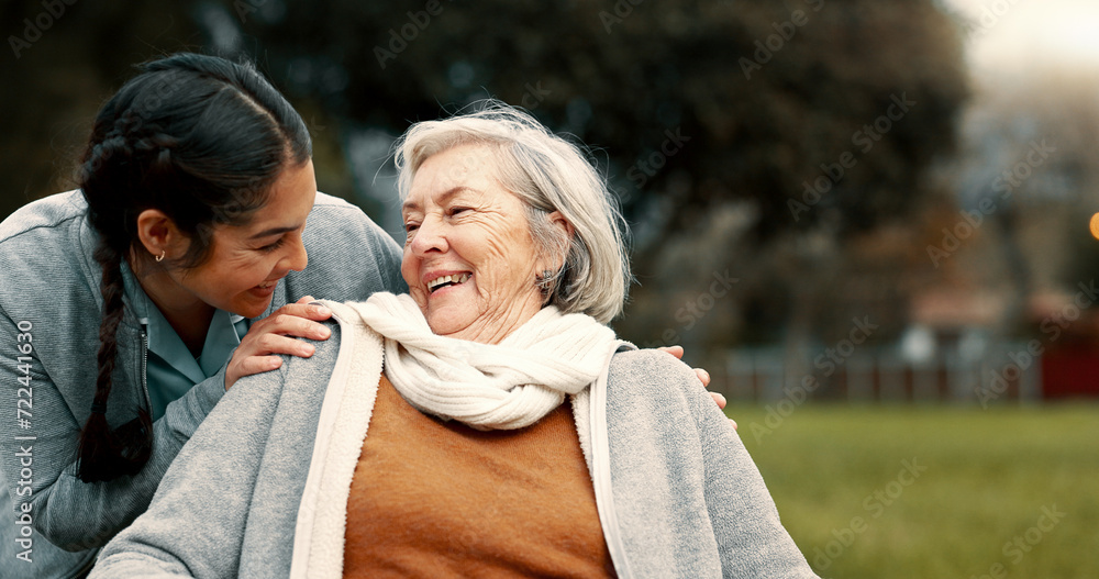 Wall mural Caregiver helping woman with disability in park for support, trust and care in retirement. Nurse talking to happy senior patient in wheelchair for rehabilitation, therapy and conversation in garden