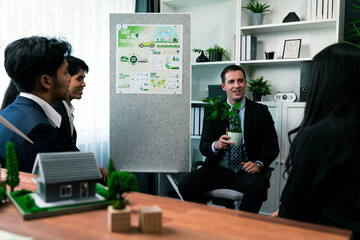 Businessman leader give presentation on corporate social responsibility with reforestation in order...