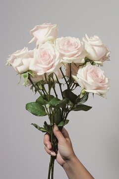 a person holding a bunch of white roses created with Generative AI