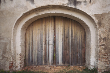 Front view of an ancient wooden gate. Old wooden door of fortified church, Biertan, Romania. Discover Romania concept.