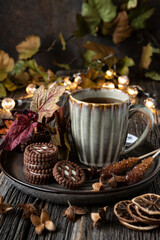 Composition with tea cup and  cookies on wooden table