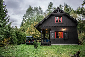 wooden colorful cottage among the greenery