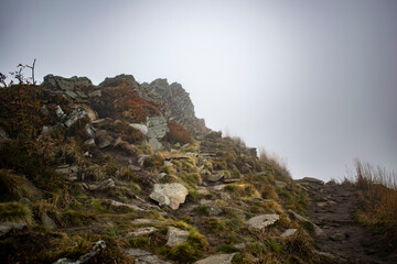 mountain stone and foggy peak in autumn