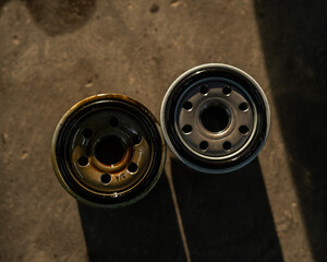 Old and new car oil filter. No people. 