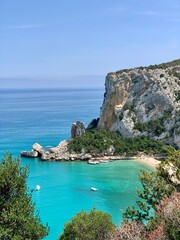 Sardinia beach blue and turquoise with cliff