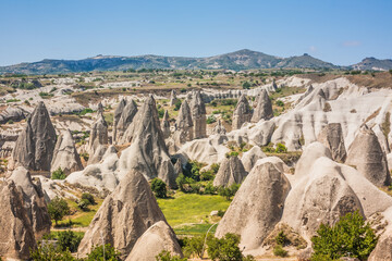 Rocky landscape in Cappadocia, Turkey. Travel in Cappadocia. Unusual semi-desert mountain ranges. Amazing Rocky summer landscape in Cappadocia Goreme