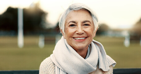 Face, elderly woman and happy on park bench on vacation, holiday or travel in winter. Portrait, smile and senior person in nature, outdoor or garden for freedom to relax for retirement in Australia - Powered by Adobe