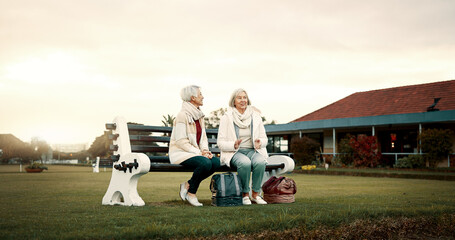 Talking, senior friends and at a club for sports, fitness break and sitting together after exercise. Happy, relax and elderly women on a field bench for conversation, retirement hobby or activity