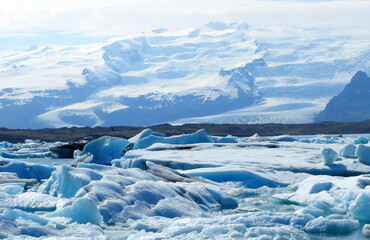 Fototapeta na wymiar Iceland glacier lake Jokulsarlon lagoon ice floes, icebergs, snow.