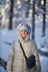 Woman Standing in Snow, Wearing Jacket