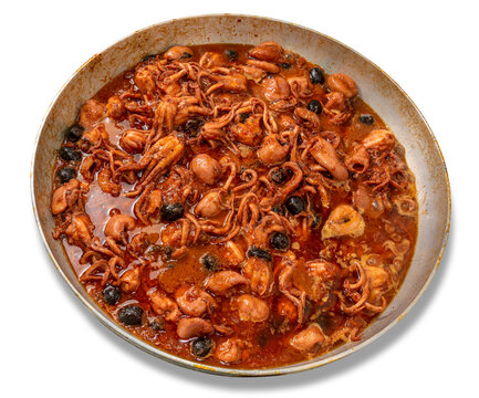 Baby Octopus in tomato sauce in aluminium pan isolated  Stewed octopus with tomatoes and olive - Italian recipe called moscardini alla Luciana recipe of Neapolitan cuisine.