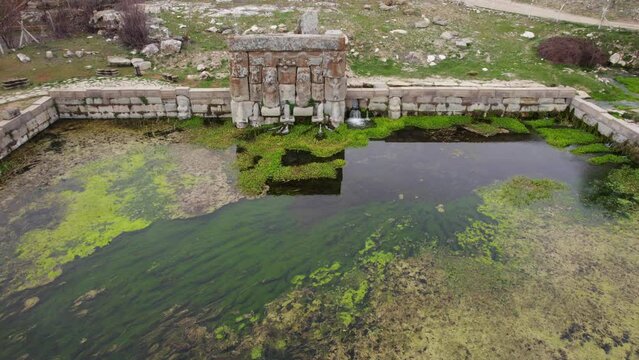 Eflatun Pinar ( Eflatunpinar) Ancient Hittite relief sculpture monument and sacred pool, and its Hittite relief scultures of Hittite gods, Beysehir Konya Turkey