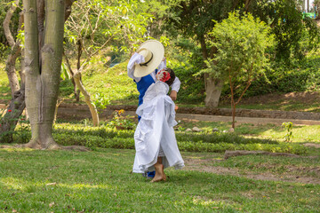 Young kids dancing marinera peruvian dance