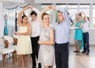 Pair dances - girls and guys in festive attire dance tango or samba