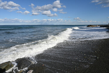 Fototapeta na wymiar waves on the beach near a restaurant on the Mediterranean coast 12