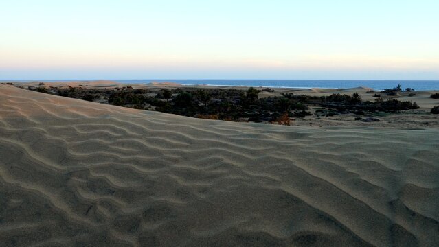 The sand dunes of Maspalomas in the Canary Islands with panoramic views of the ocean