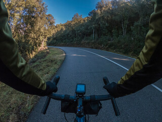 Cyclist point of view driving on a lonely road on a blue road bicycle on a beautiful sunny...