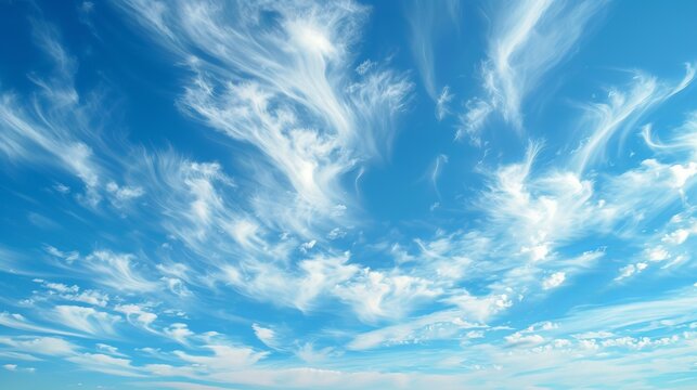 A tranquil landscape, adorned with fluffy cumulus clouds against an azure blue sky, invites one to bask in the beauty of nature on a sunny daytime outing