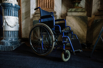 Old wheelchair inside of abandoned hospital
