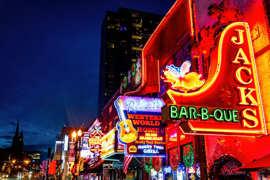 Famous Neon signs on Beale street illuminated at night in downtown Nashville