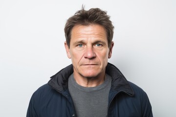 Middle-aged man with serious expression on his face. Studio shot.