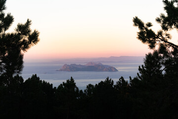 Sunset view of the Cies Islands in the distance and the Vigo estuary from a mountain