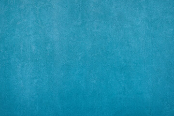 Empty plastered blue cement painted plain rough surface clean wall