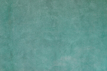 Empty plastered green cement painted plain rough surface clean wall