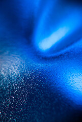 Fototapeta premium Close-Up View of Blue Light Refraction on a Textured Surface