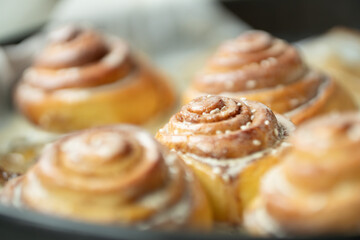 Cinnabon. Homemade glazed buns with sesame and cinnamon. delicious pastries or a warm roll.