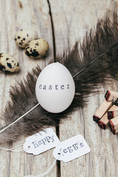 Rustic Easter Egg Setup with Feather and Stamps