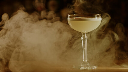 Cocktail in smoke on the bar