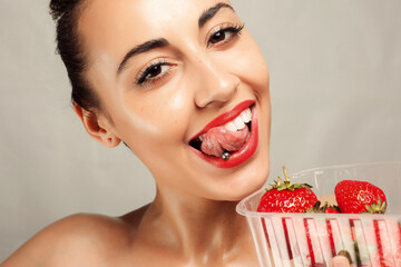 Sexy Woman Eating Strawberry - obrazy, fototapety, plakaty