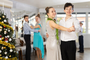 Boy and girl dance couples ballroom dance waltz in studio