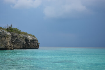 Little Knip beach - paradise white sand beach with blue sky and clear azure water in Curacao, Netherlands Antilles, a Caribbean tropical Island.